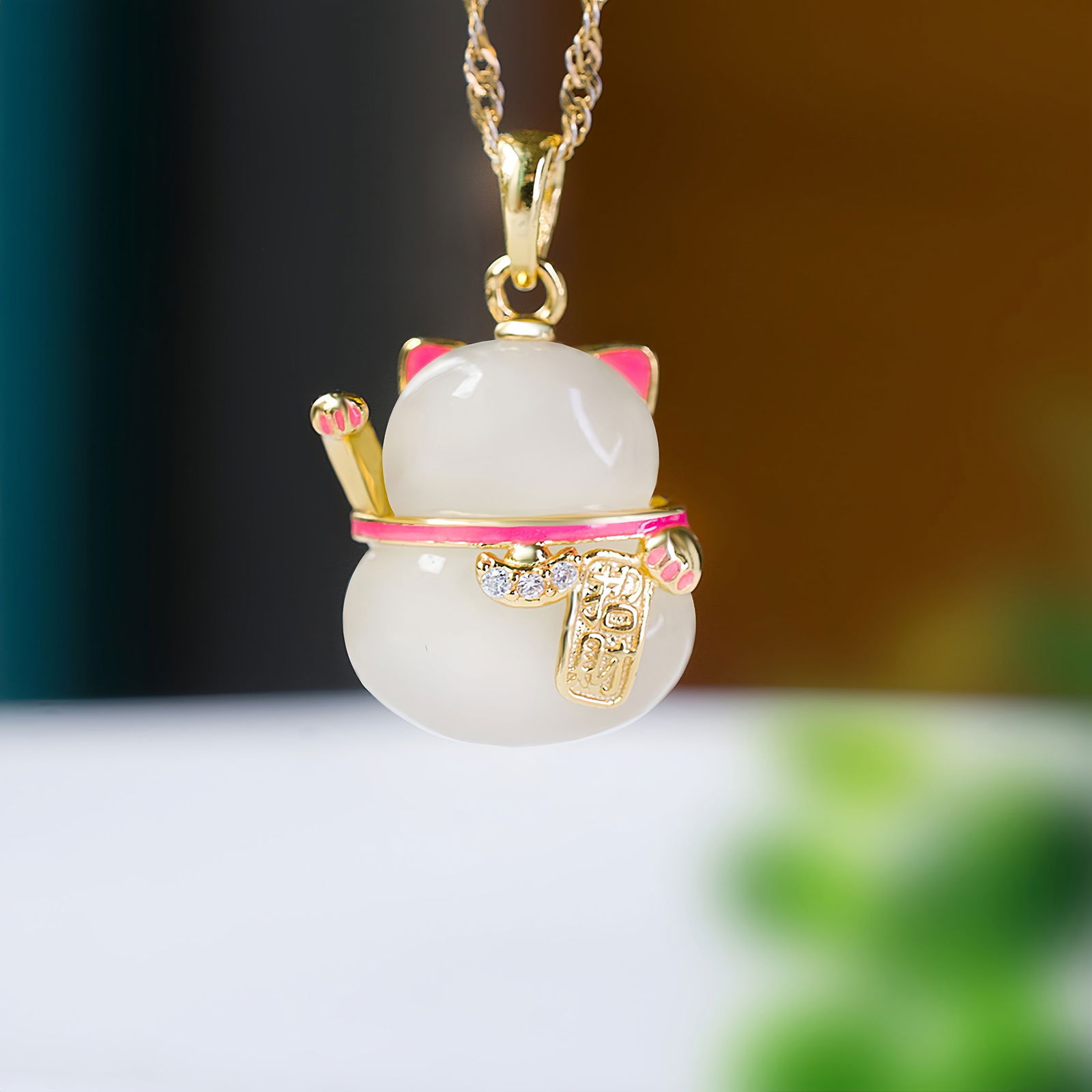 A Exquisite Silver Inlaid Hotan Jade Cat-shaped Pendant: A Exquisite Silver Inlaid Hotan Jade Cat-shaped Pendant,Size:0.5inx0.6in 银镶和田玉招财猫吊坠