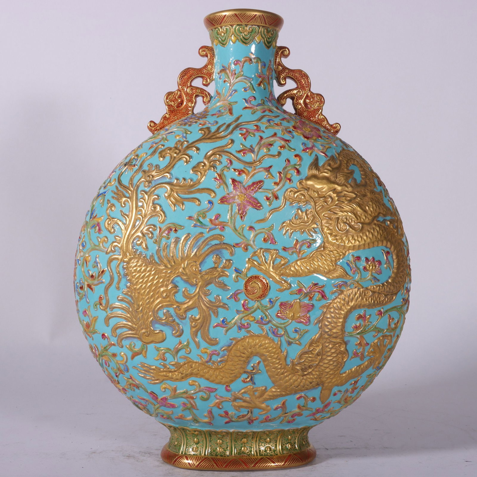 A Rare Enamel Turquoise Ground Painted Gold Lotus,Dragon and Phoenix Pattern Dragon-Ears Vase: A Rare Enamel Turquoise Ground Painted Gold Lotus,Dragon and Phoenix Pattern Dragon-Ears Vase,Qing Dynasty, China,Qianlong Six-character Mark,Size:12.6inx9.1in 珐琅彩松石