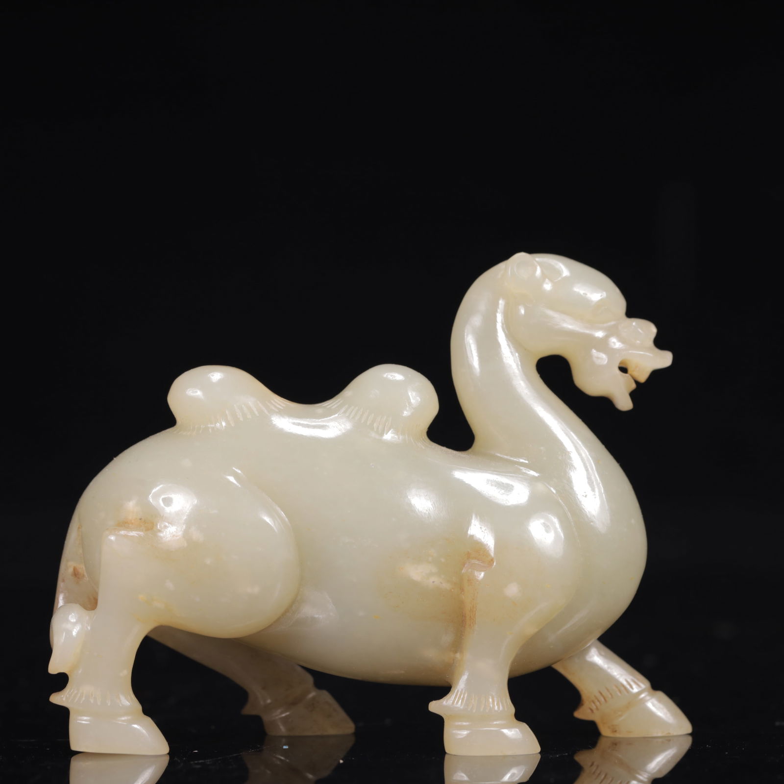 An Exquisite White Jade Auspicious Beast Ornament: An Exquisite White Jade Auspicious Beast Ornament,Qing Dynasty,China,Size:3.1inx1.2inx2.6in,Weight:149g 白玉瑞兽摆件,中国清代