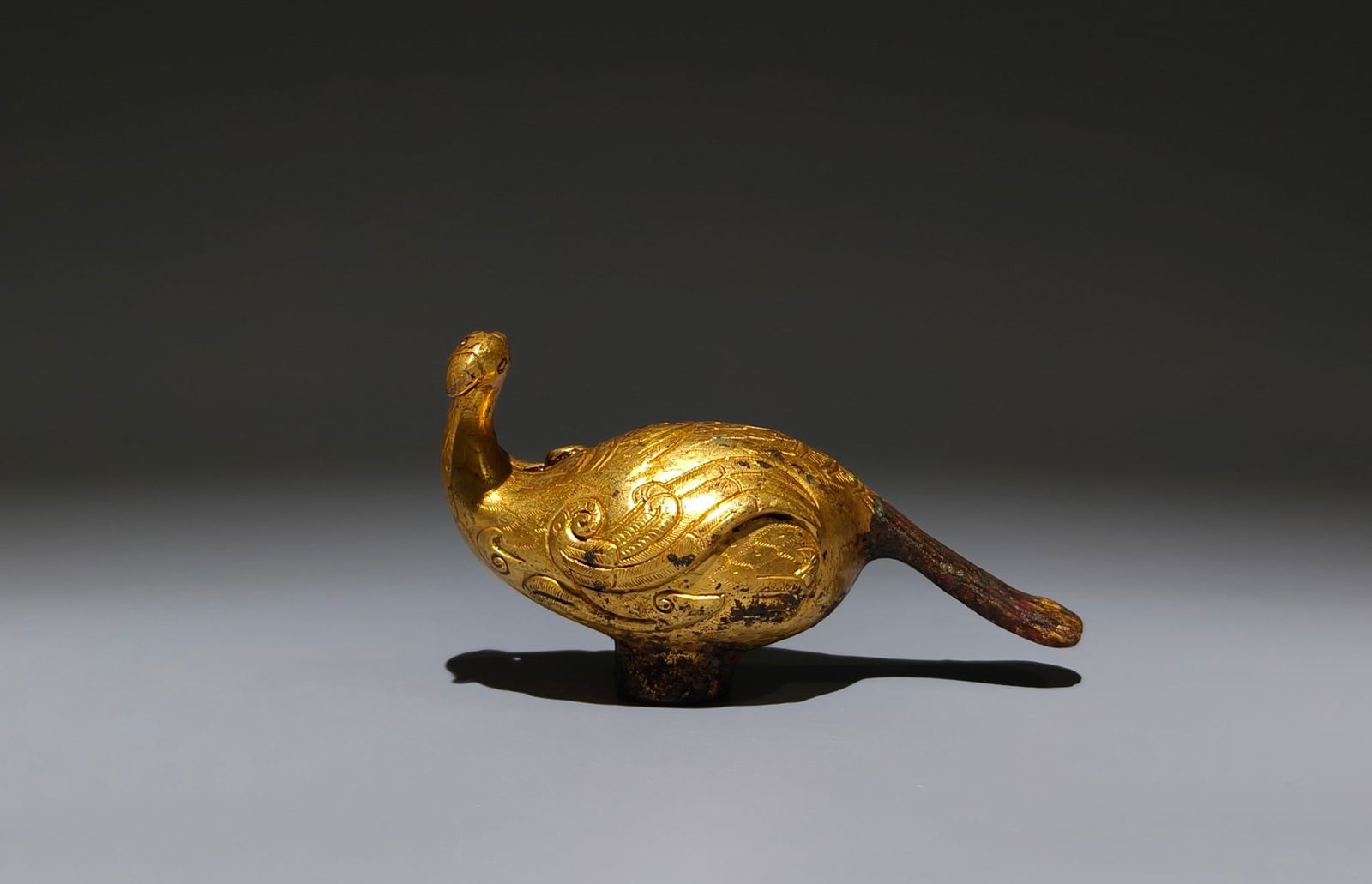 An Exquisite Gilt Bronze Bird-Shaped Pommel: An Exquisite Gilt Bronze Bird-Shaped Pommel,Han Dynasty, China,Size:2.4inx4.1inx1.6in 铜鎏金鸟形杖首 ,中国汉代