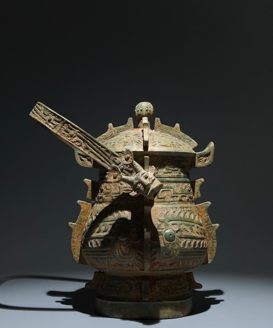 An Archaic Bronze Beast-Face Pattern Ewer: An Archaic Bronze Beast-Face Pattern Ewer,the Western Zhou Dynasty in China,Size:12.2inx8.3inx7.5in 