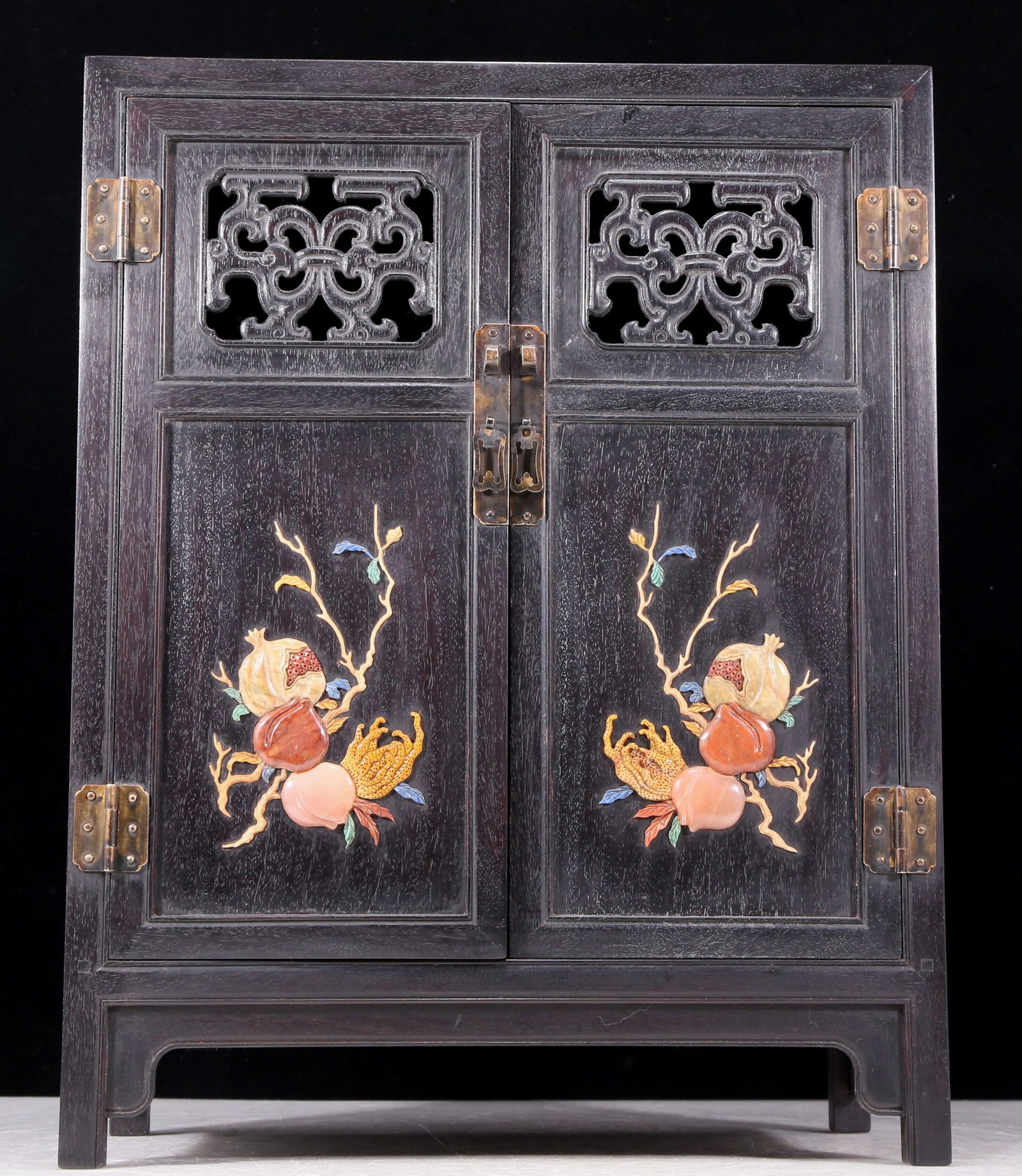An exquisite zitanwood cabinet inlaid with gems and patterns of fortune, wealth, longevity and (1 of 13)