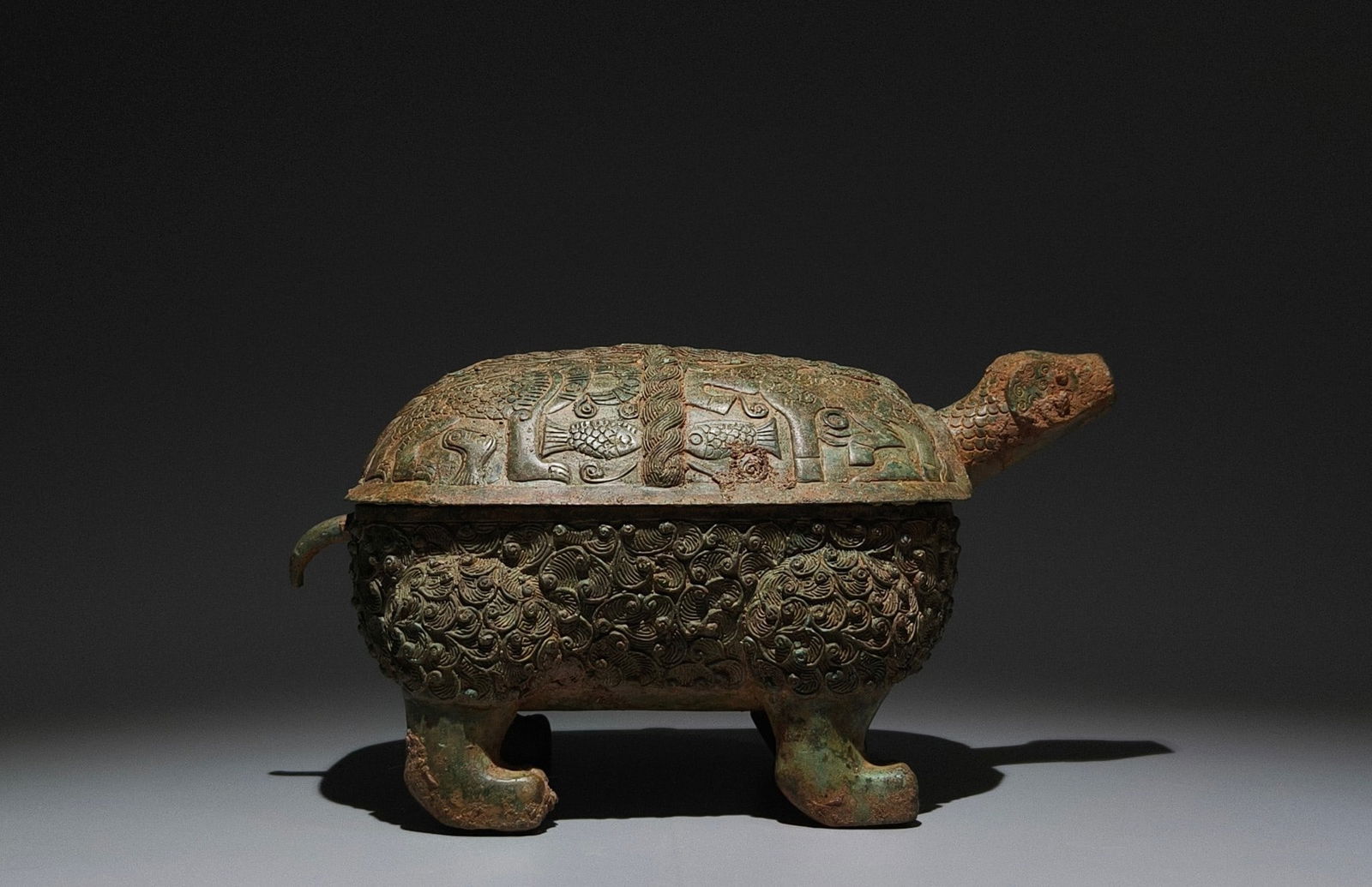 An Archaic Bronze Auspicious Beast Pattern Turtle-Shaped Cover Box,With Inscription: An Archaic Bronze Auspicious Beast Pattern Turtle-Shaped Cover Box,With Inscription,the Warring States period in China,Size:6.7inx12.6inx6.7in 青铜瑞兽纹龟形&