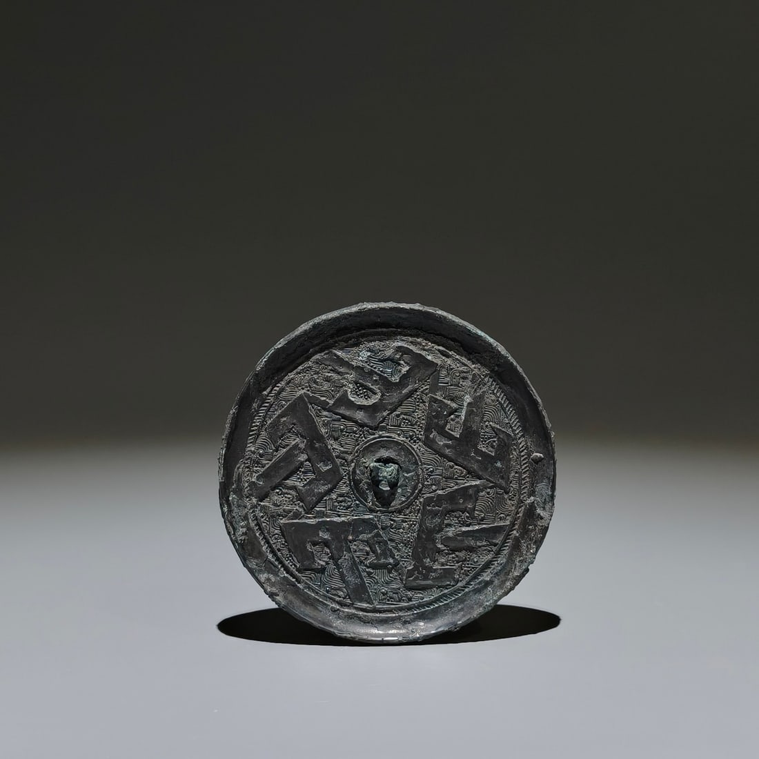 An Archaic Bronze Shan-Character Pattern Round Mirror: An Archaic Bronze Shan-Character Pattern Round Mirror,the Warring States period in China,Size:3.7in 青铜山字纹圆镜,中国战国时