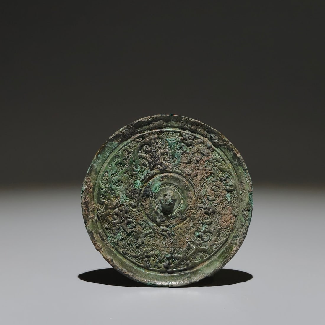 An Archaic Bronze Coiling Dragon Pattern Round Mirror (1 of 9)