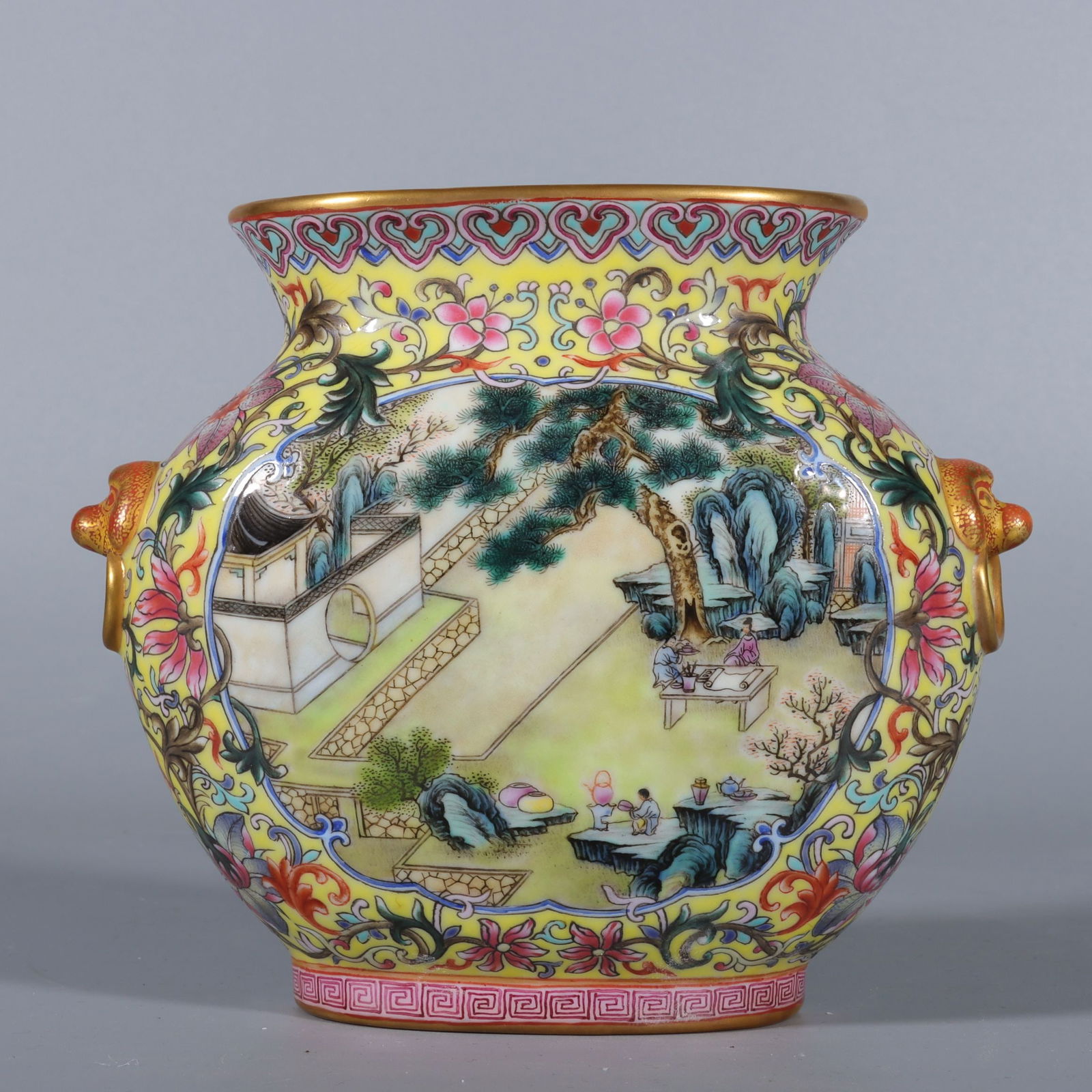 An Exquisite Famille-Rose Yellow Ground Painted Gold Landscape and Figure Pattern Lion-Ears Vase (1 of 9)