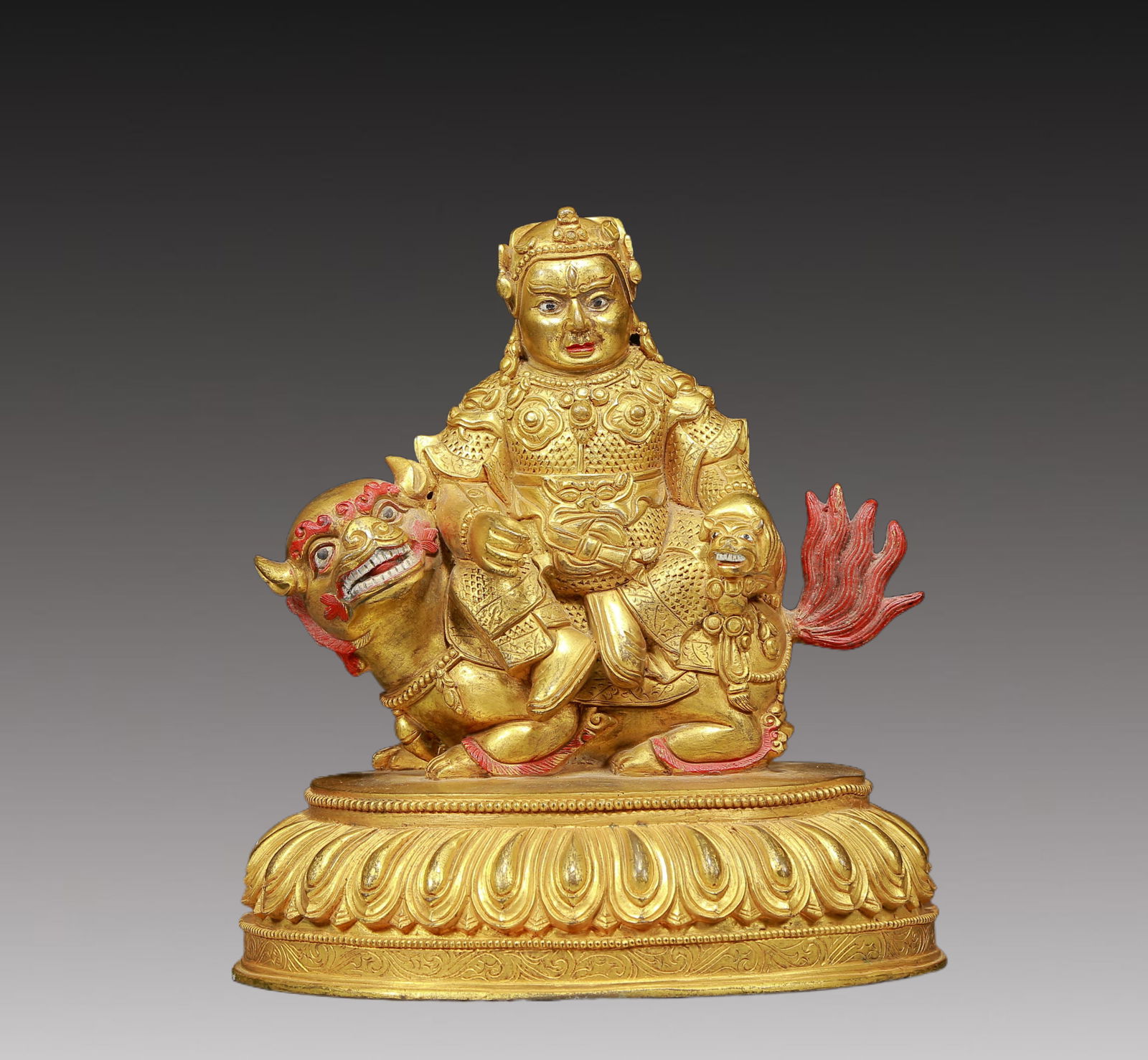 A Solemn Gilt Bronze Statue of Mammon Rides the Lion: A Solemn Gilt Bronze Statue of Mammon Rides the Lion,Ming Dynasty, China,Size:8.3inx6.3inx9.1in,Weight:4115g 铜鎏金骑狮财神像，明代