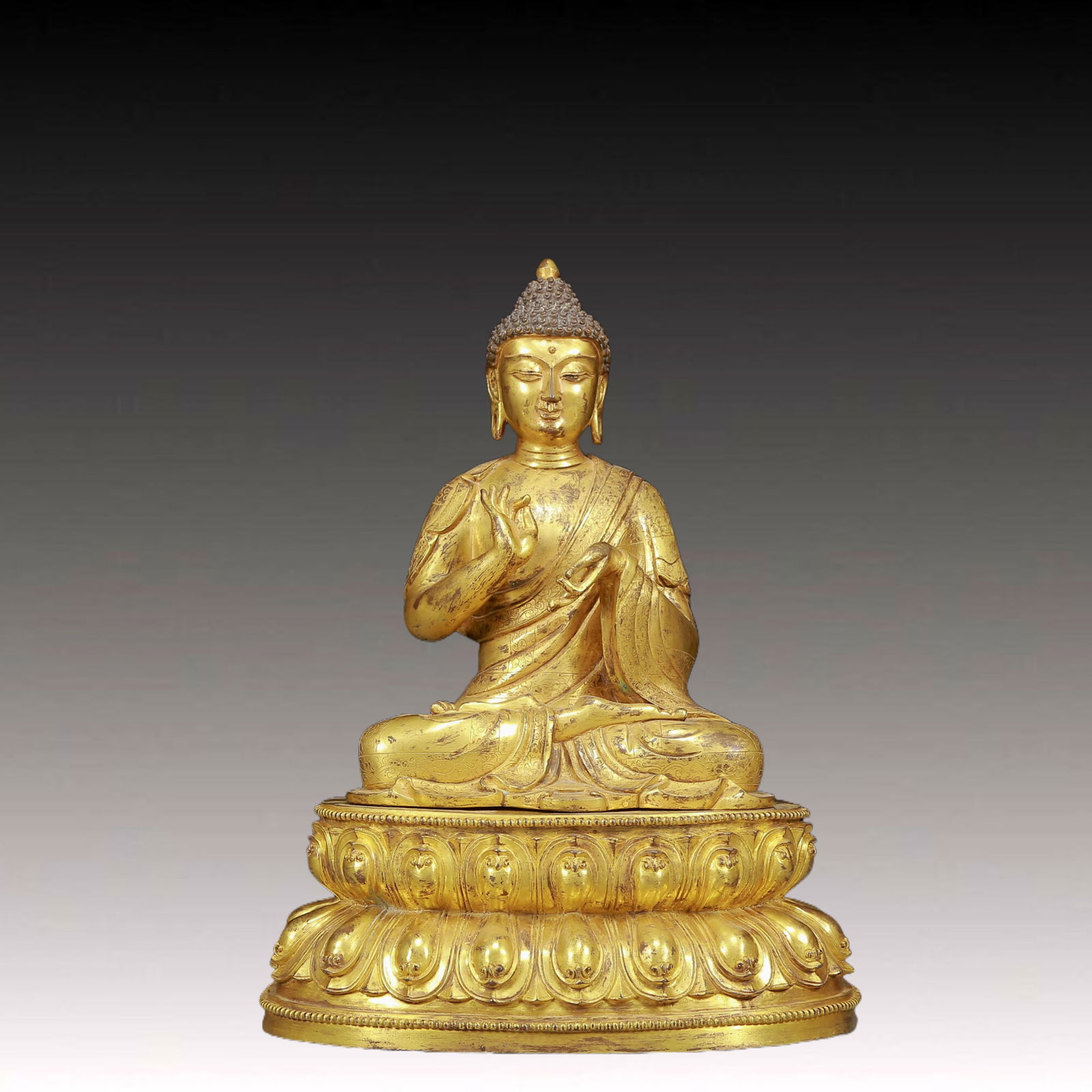 A Solemn Gilt Bronze Statue of Sakyamuni: A Solemn Gilt Bronze Statue of Sakyamuni,Ming Dynasty, China,Size:12.2inx9.1inx16.5in,Weight:12535g 铜鎏金释迦摩尼像，明代