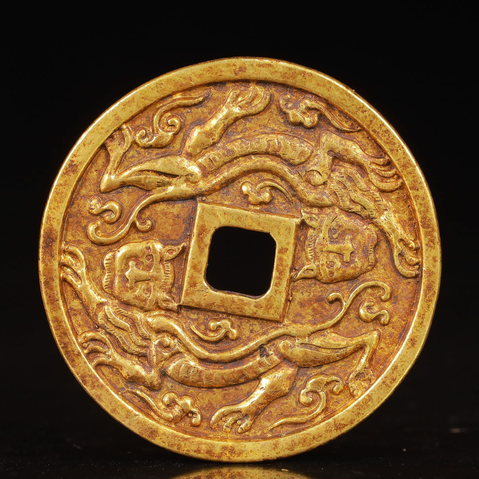 An Exquisite Gilt Bronze Auspicious Beast Pattern Coin: An Exquisite Gilt Bronze Auspicious Beast Pattern Coin,Liao Dynasty,China,Size:2inx0.9in,Weight:35g 铜鎏金瑞兽纹钱币,中国辽代