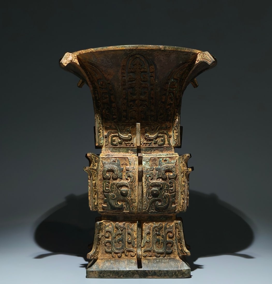 An Archaic Bronze Beast-Face Pattern Libation Cup,With Inscription: An Archaic Bronze Beast-Face Pattern Libation Cup,With Inscription,Shang Dynasty, China,Size:15.4inx12in 