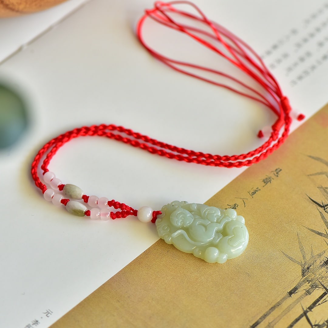 An Exquisite White Jade Monkey Pattern Pendant: An Exquisite White Jade Monkey Pattern Pendant,Size:33mmx20mm 白玉猴纹吊坠