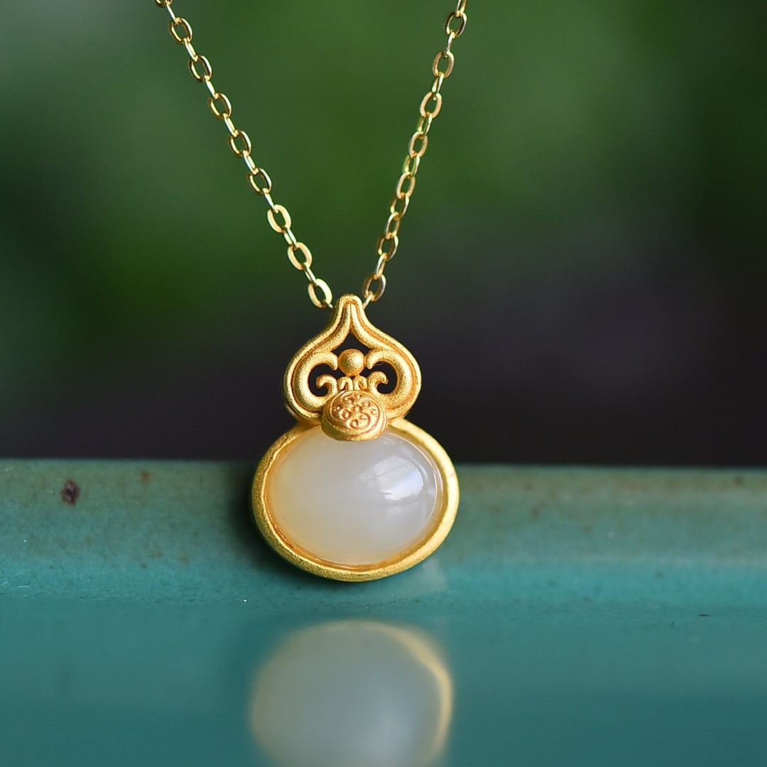 An Exquisite Sterling Silver-Gold Plated Inlaid White Jade Pendant: An Exquisite Sterling Silver-Gold Plated Inlaid White Jade Pendant 纯银镀金镶白玉吊坠