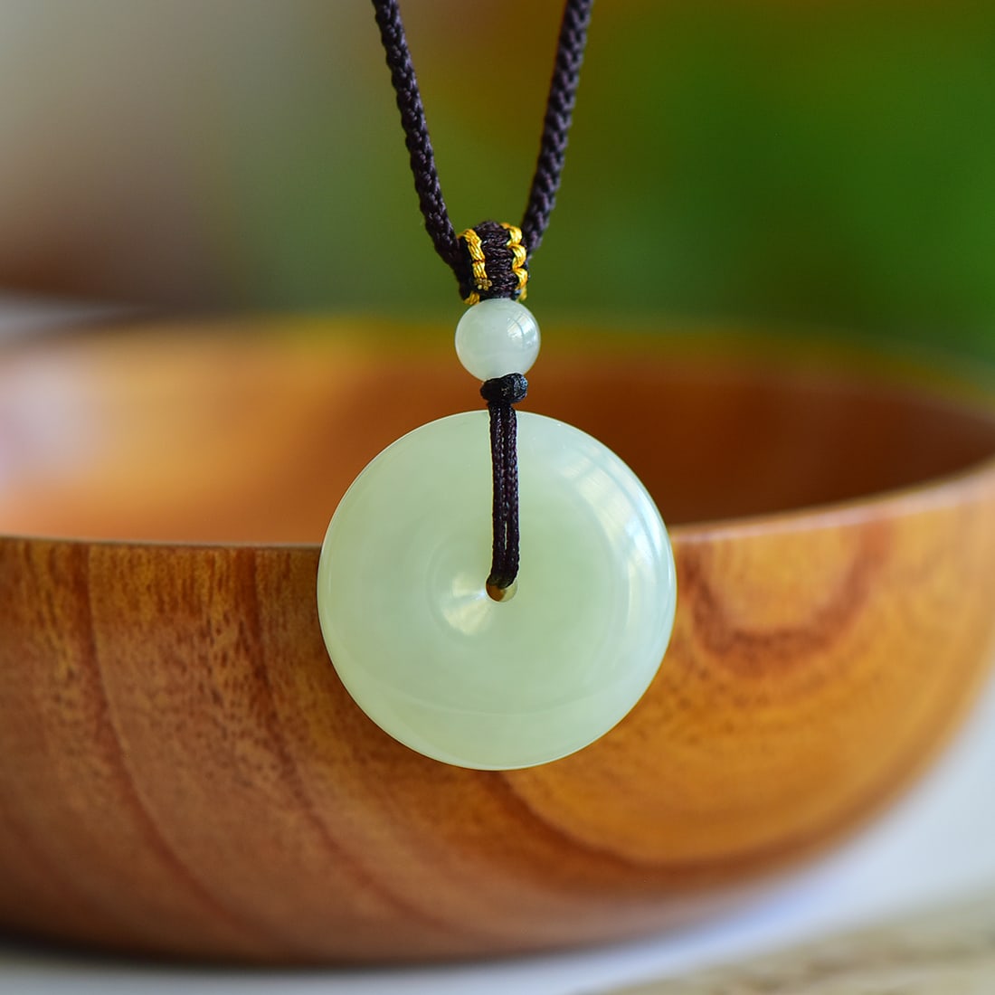 An Exquisite Greenish Jade Pendant: An Exquisite Greenish Jade Pendant,Size:24mmx26mm 寓意:吉祥平安扣,玉脂白润,无裂无纹 