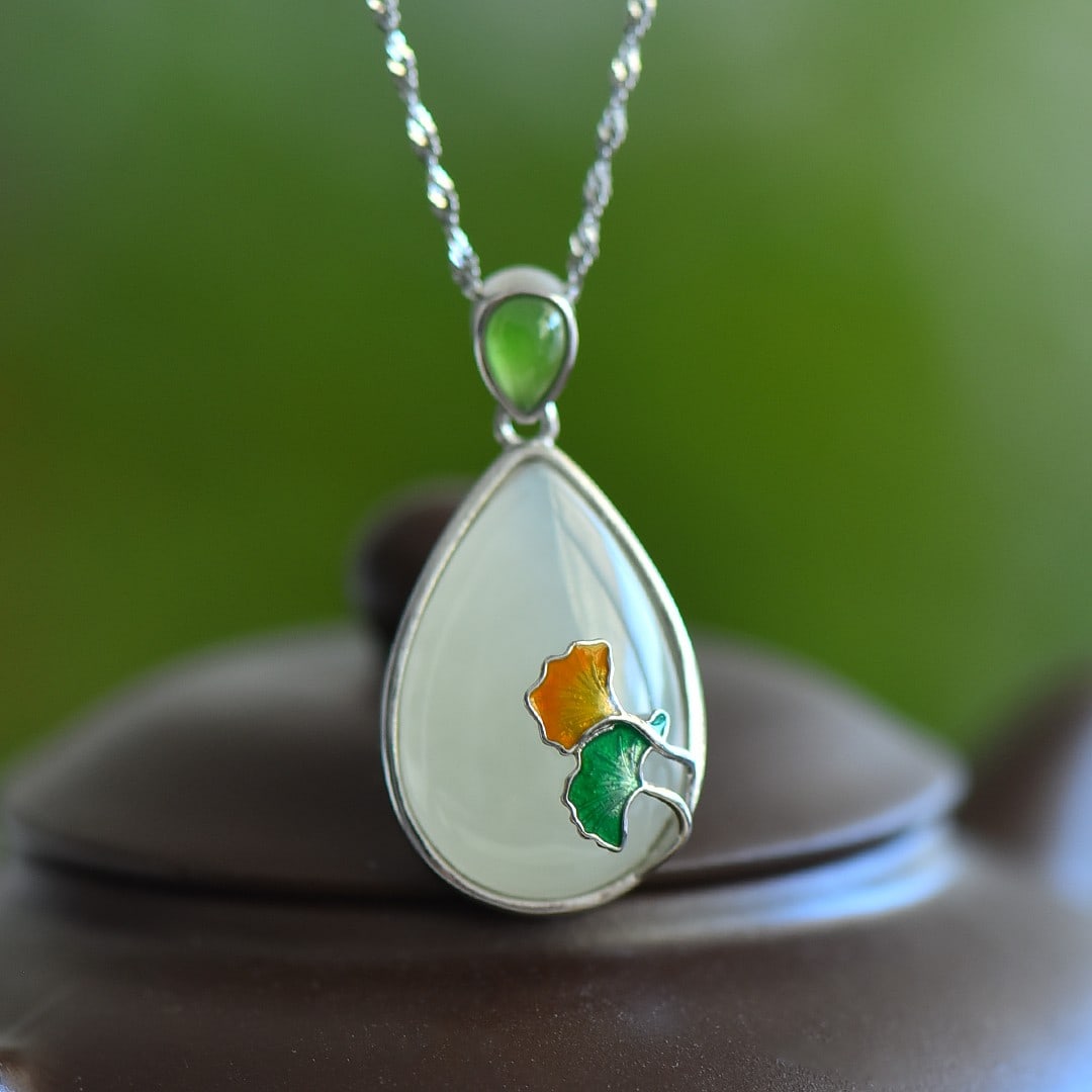 An Exquisite Sterling Silver Inlaid White Jade Pendant: An Exquisite Sterling Silver Inlaid White Jade Pendant 纯银镶白玉吊坠