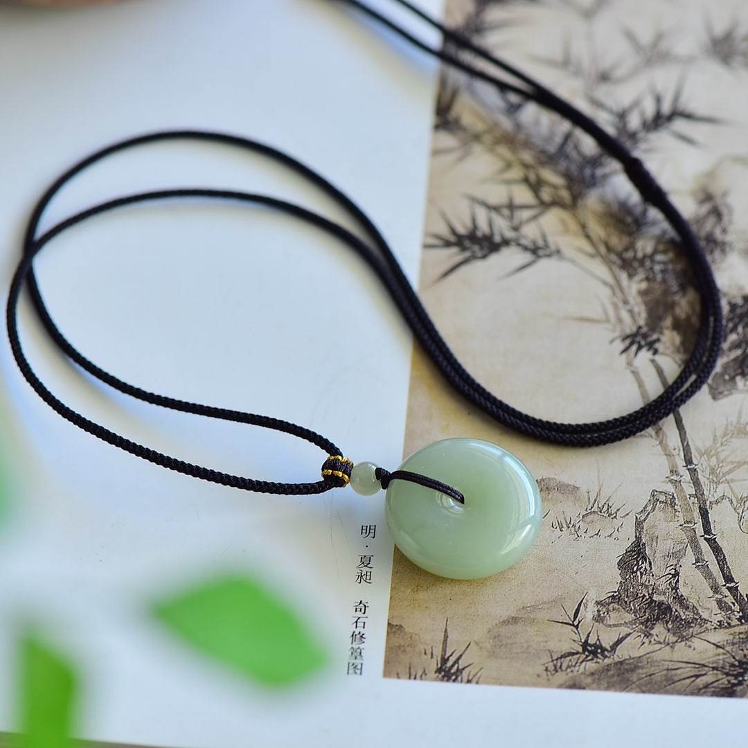 An Exquisite Greenish Jade Pendant: An Exquisite Greenish Jade Pendant,Size:24mmx26mm 寓意:吉祥平安扣,玉脂白润,无裂无纹 