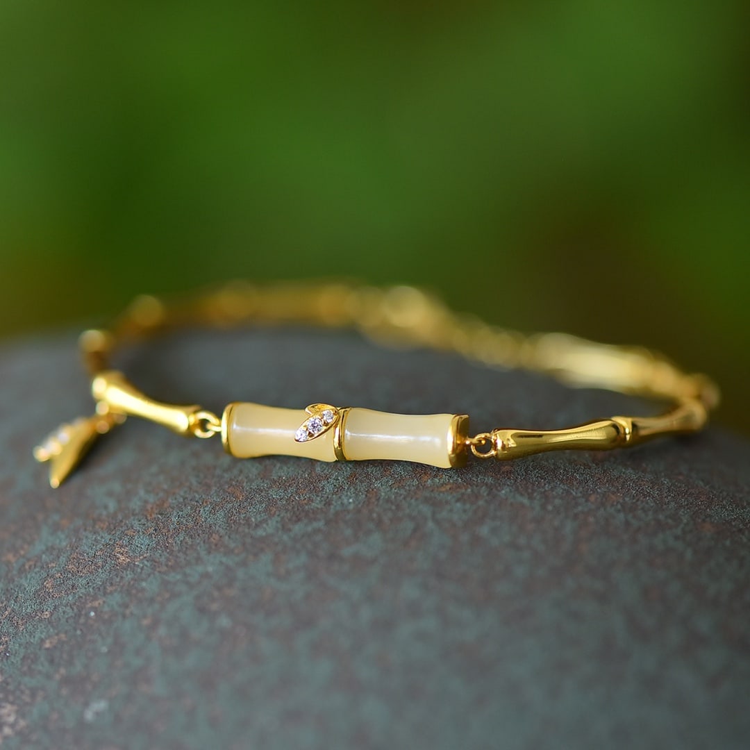 An Exquisite Sterling Silver-Gold Plated Inlaid White Jade Bracelet: An Exquisite Sterling Silver-Gold Plated Inlaid White Jade Bracelet,Size:5mmx10mm 纯银镀金镶白玉手链