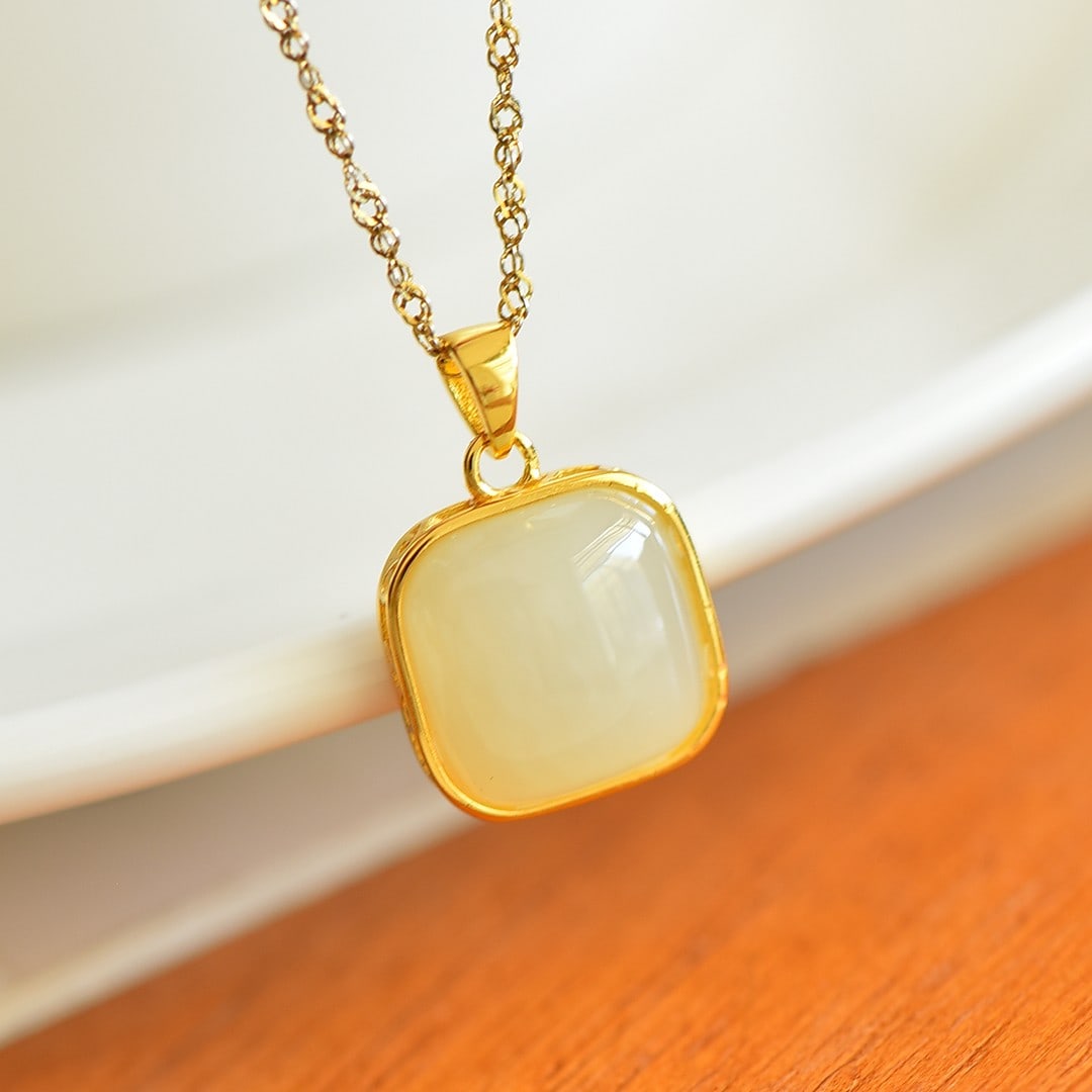 An Exquisite Sterling Silver-Gold Plated Inlaid White Jade Pendant: An Exquisite Sterling Silver-Gold Plated Inlaid White Jade Pendant,Size:12mmx12mm 纯银镀金镶白玉吊坠
