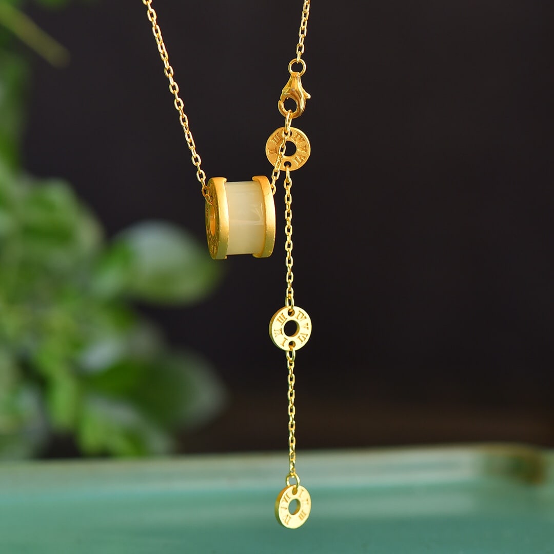 An Exquisite Sterling Silver-Gold Plated Inlaid White Jade Pendant: An Exquisite Sterling Silver-Gold Plated Inlaid White Jade Pendant 纯银镀金镶白玉吊坠