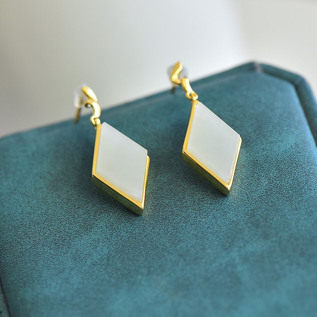A Pair of Exquisite Sterling Silver-Gold Plated Inlaid White Jade Earrings: A Pair of Exquisite Sterling Silver-Gold Plated Inlaid White Jade Earrings,Size:10mmx17mm 一对纯银镀金镶白玉耳环