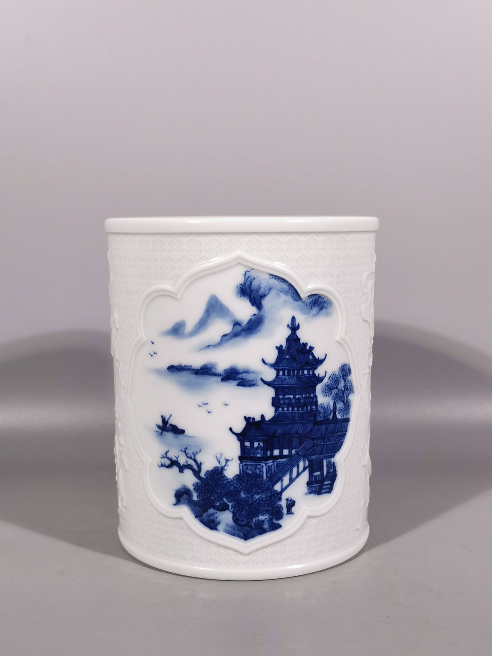 A Exquisite Blue and White Carved Landscape Pattern Brush Pot: A Exquisite Blue and White Carved Landscape Pattern Brush Pot,Qing Dynasty, China,Qianlong Six-character Mark,Size: 5.3inx4.3in 