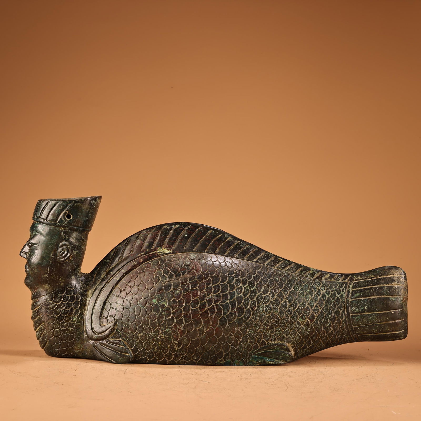 A Exquisite Bronze Human Face Fish Ornament: A Exquisite Bronze Human Face Fish Ornament,Ancient Time,China,Size:5.9inx13.4in,Weight:2200g 青铜人面鱼摆件,远古时期