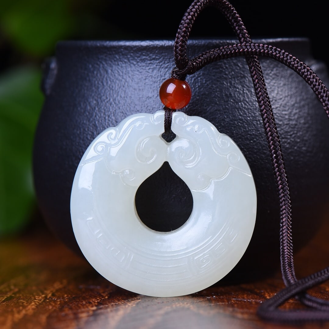 A Exquisite Hotan Jade Dragon-shaped Pendant: A Exquisite Hotan Jade Dragon-shaped Pendant,Size:1.3inx1.3in; Size:1.4inx1.4in 和田玉双龙吊坠