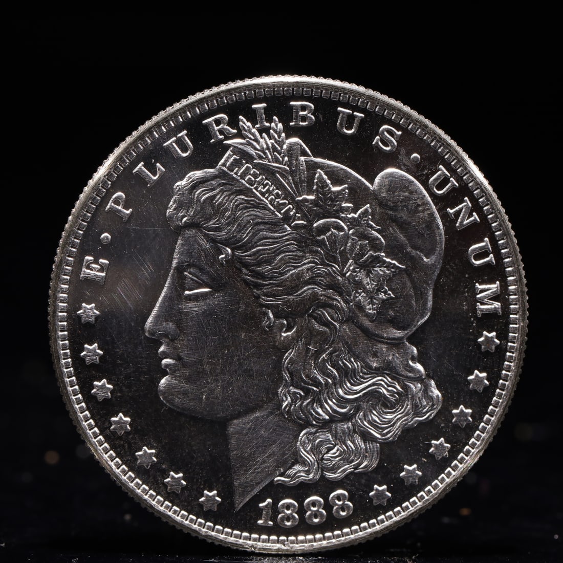 USA Morgan Dollar 1888 Coin: Obv: profile bust with date below and E PLURIBUS UNUM legend and stars around. Rev: eagle with In God we trust above within wreath with UNITED STATES OF AMERICA ONE DOLLAR legend. IN GOD WE TRUST /