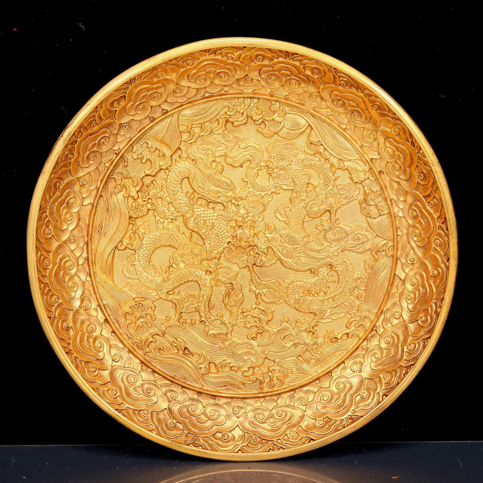 An Exquisite Gilt Bronze Seawater and Dragon Pattern Plate: An Exquisite Gilt Bronze Seawater and Dragon Pattern Plate，Qing Dynasty, China，Qianlong Four-character Mark，Size:7.1inx1in，Weight:750g 铜鎏金祥É