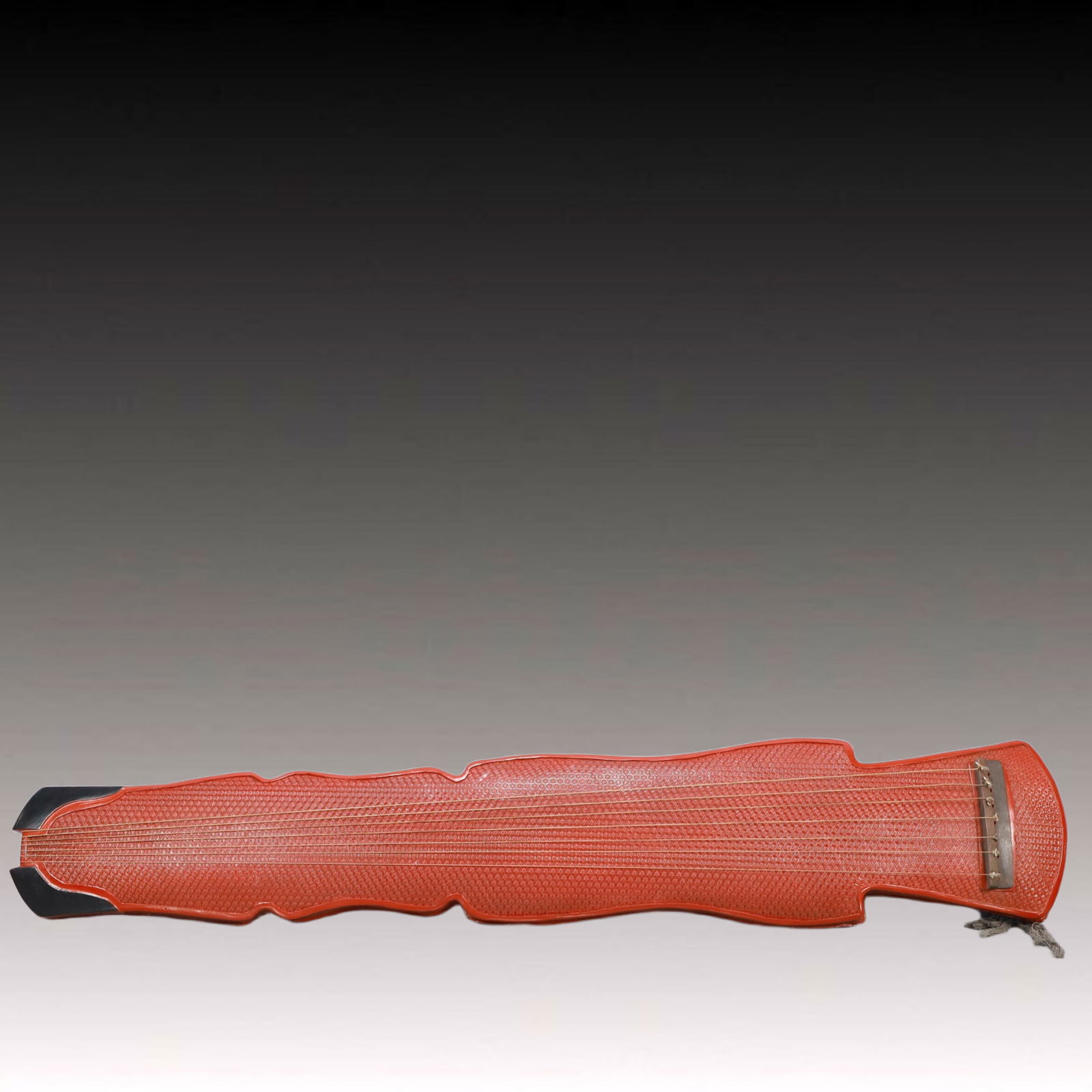 An Exquisite Carved Red Lacquer 'qin' Ornament: An Exquisite Carved Red Lacquer 'qin' Ornament,Qing Dynasty, China,Qianlong Four-character Mark,Size:48.8inx9.4inx5.1in,Weight:4100g 剔红漆器琴摆件,中&#