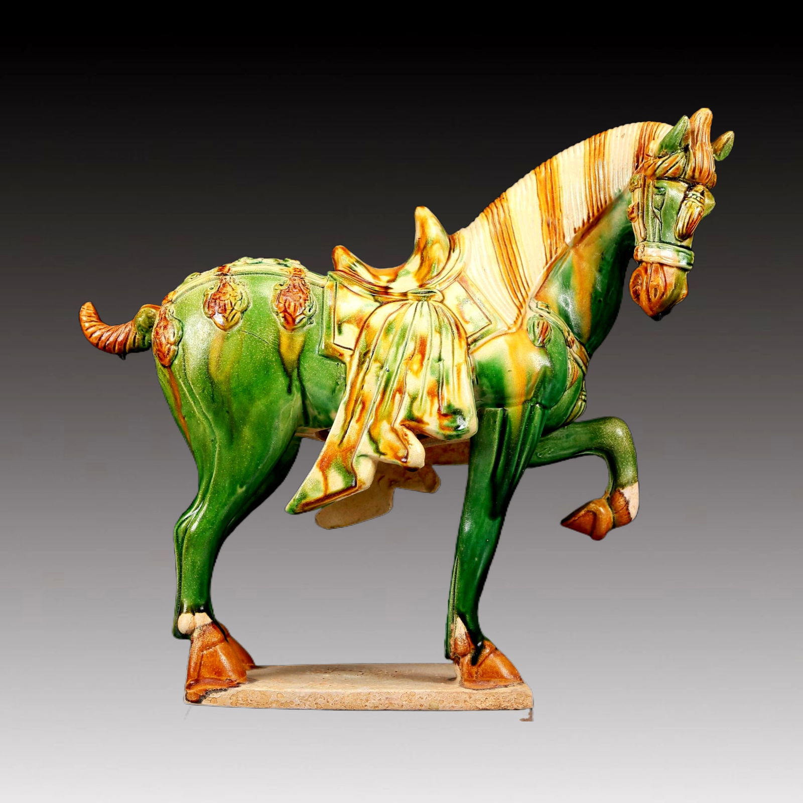 A Rare Tang Tri-Color Glazed Pottery Horse Ornament: A Rare Tang Tri-Color Glazed Pottery Horse Ornament,Tang Dynasty, China,Chinese Tang Tri-colored Pottery, or Tang Sancai, flourished during the Tang Dynasty (618–907 AD). It's renowned for its