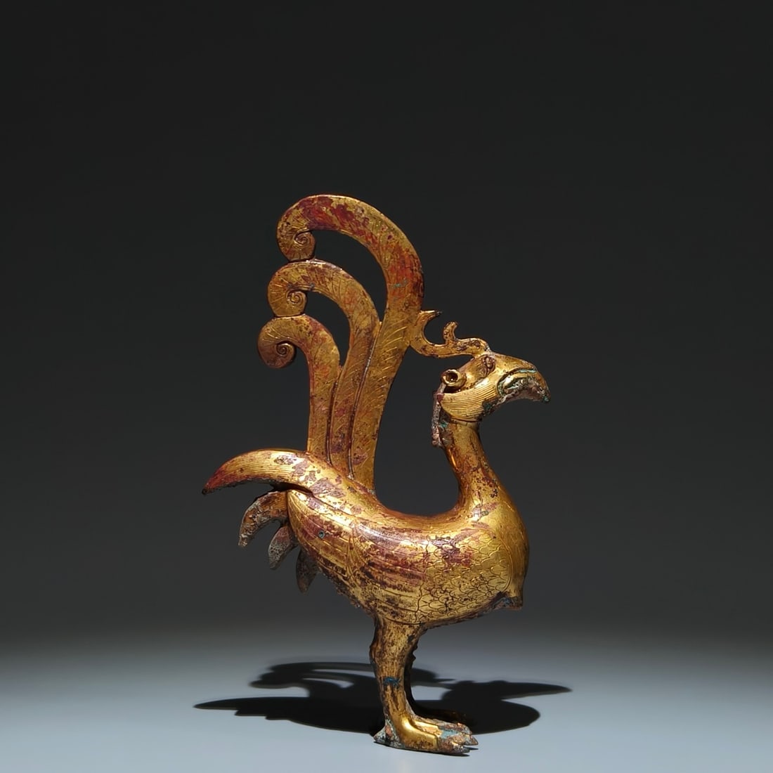 A Rare Gilt Bronze Phoenix Ornament: A Rare Gilt Bronze Phoenix Ornament,Han Dynasty, China,Size:8.9inx5.7inx2.2in 铜鎏金凤摆件,中国汉代
