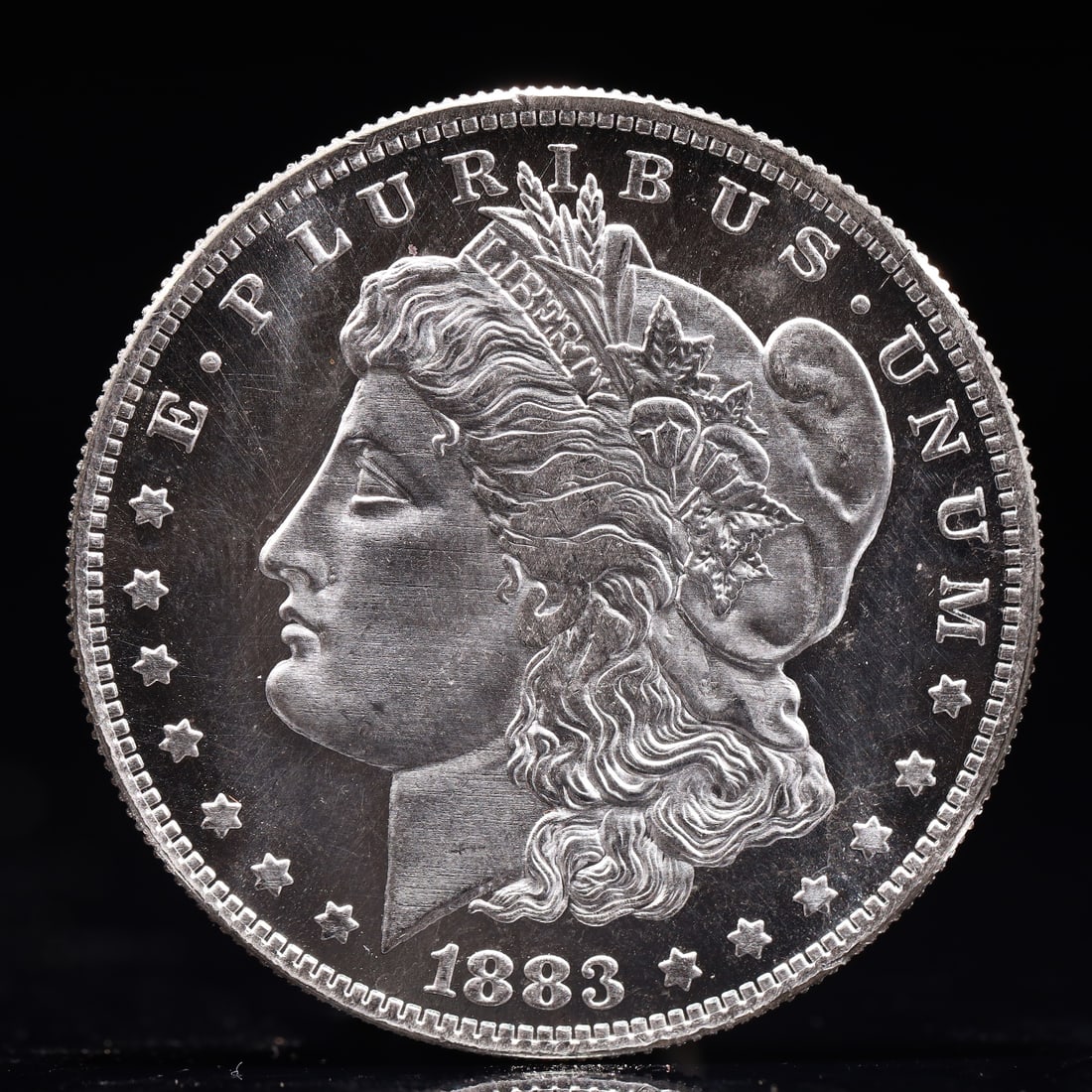 USA Morgan Dollar 1883 Coin: Obv: profile bust with date below and E PLURIBUS UNUM legend and stars around. Rev: eagle with In God we trust above within wreath with UNITED STATES OF AMERICA ONE DOLLAR legend. IN GOD WE TRUST /
