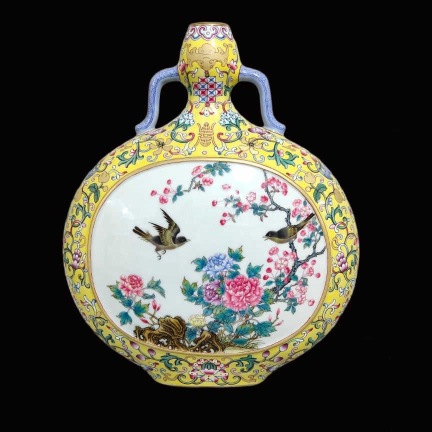 An Exquisite Yellow Ground Famille-Rose Flower and Bird Pattern Double-Ears Vase: An Exquisite Yellow Ground Famille-Rose Flower and Bird Pattern Double-Ears Vase,Qing Dynasty,China,Qianlong Six-Character Mark,Size:11.6inx9.3in 