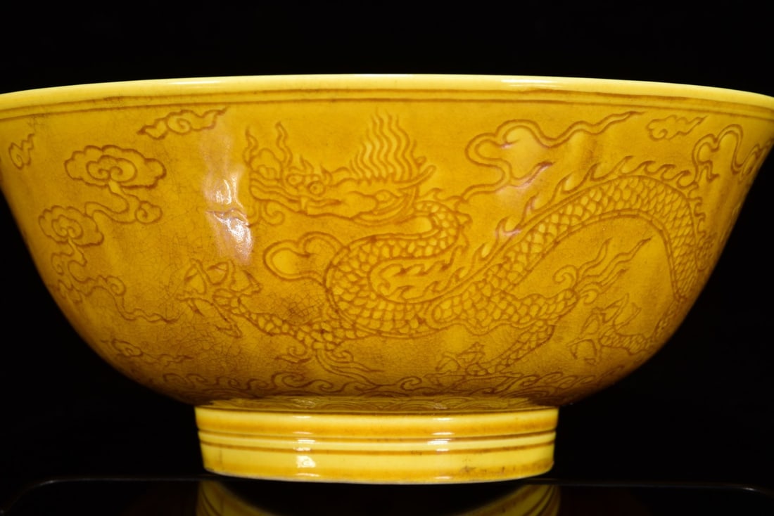 An Exquisite Yellow Glazed Auspicious Cloud and Dragon Pattern Bowl: An Exquisite Yellow Glazed Auspicious Cloud and Dragon Pattern Bowl,Ming Dynasty,China,Hongzhi Six-character Mark,Size:7.1inx7.1in 