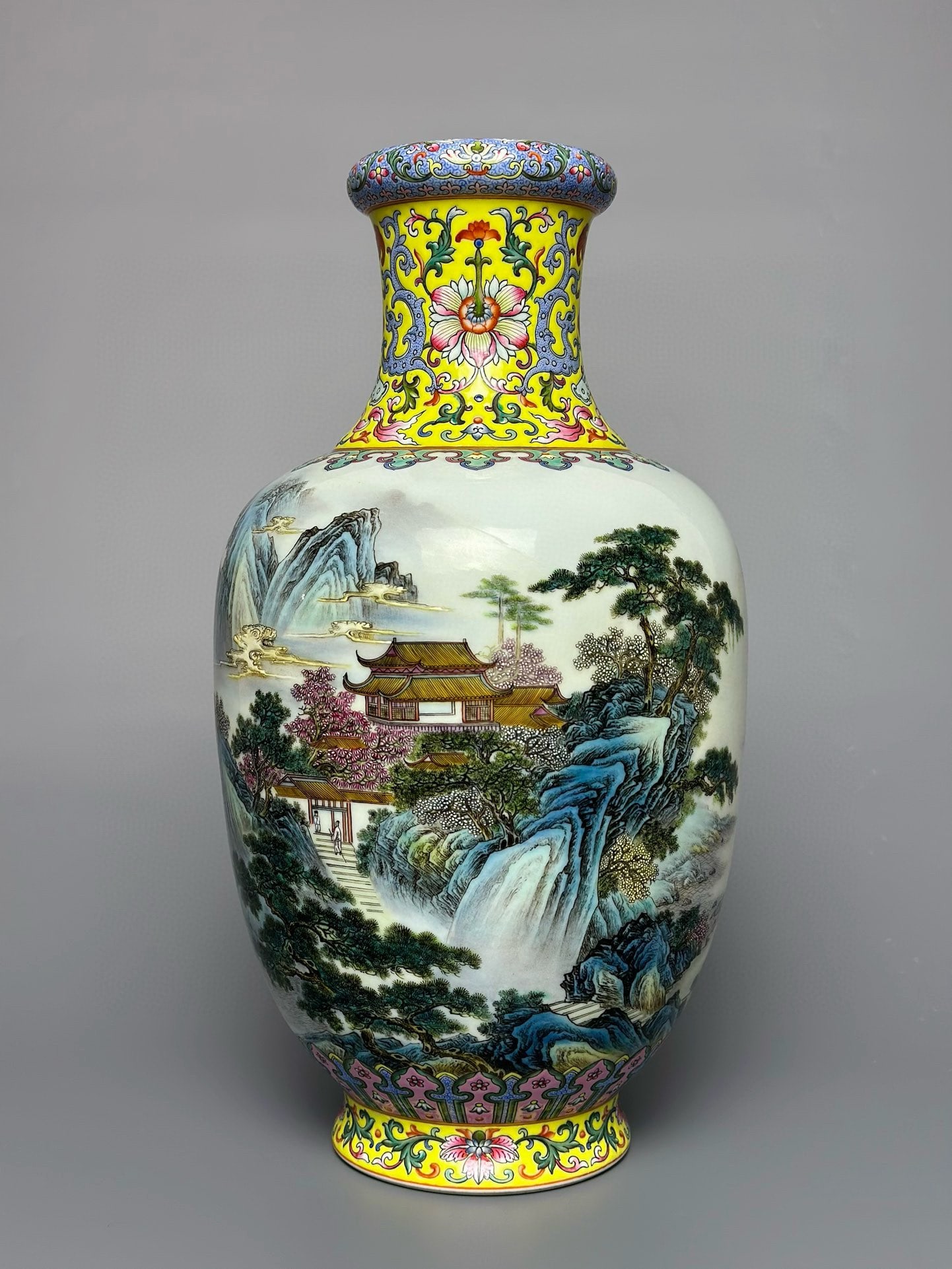 An Exquisite Yellow Ground Enamel Landscape Pattern Vase: An Exquisite Yellow Ground Enamel Landscape Pattern Vase,Qing Dynasty,China,Qianlong Six-character Mark,Size:12.8inx6.6in 黄地珐琅彩山水纹瓶,È
