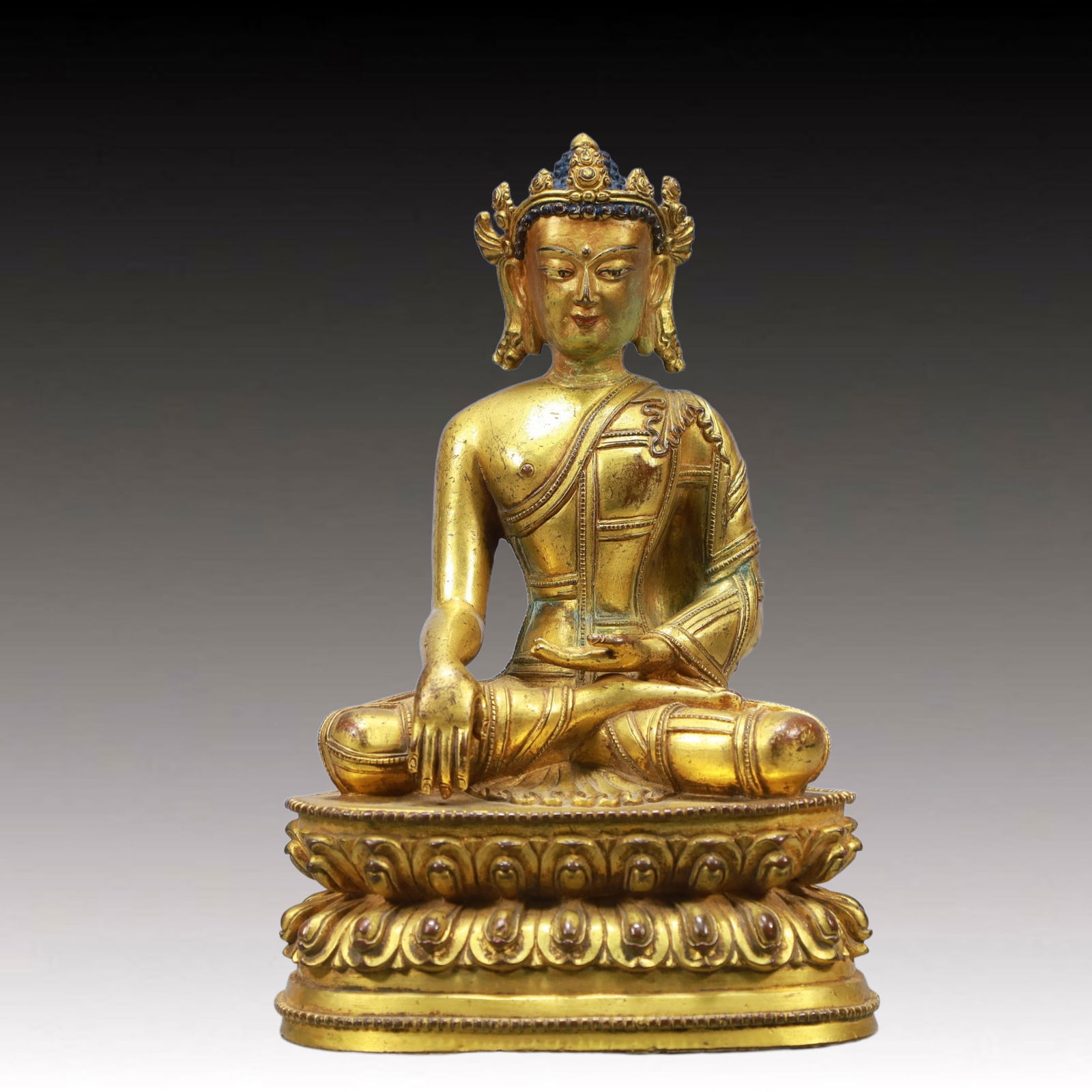 A Solemn Gilt Bronze Statue of Sakyamuni: A Solemn Gilt Bronze Statue of Sakyamuni ,Ming Dynasty, China,Size:5.5inx4.3inx8.3in Weight:2150g 铜鎏金释迦牟尼像,中国明代