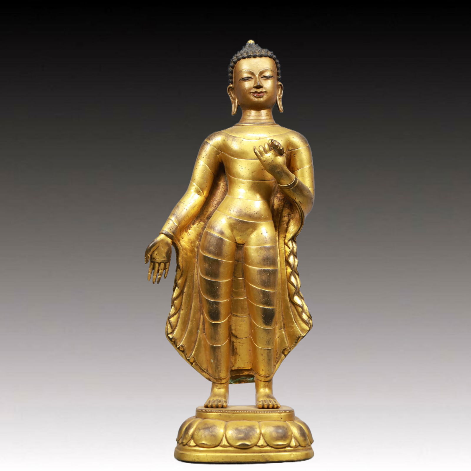 A Solemn Gilt Bronze Statue of Sakyamuni, With Inscription: A Solemn Gilt Bronze Statue of Sakyamuni, With Inscription, Ming Dynasty, China, Size:5.5inx4.7inx20.9in, Weight:7150g 铜鎏金如来像,带铭文,中