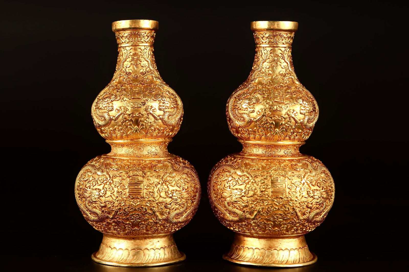 A Pair of Exquisite Gilt Bronze Auspicious Cloud and Dragon Pattern Gourd-Shaped Vases: A Pair of Exquisite Gilt Bronze Auspicious Cloud and Dragon Pattern Gourd-Shaped Vases,Qing Dynasty, China, Qianlong Four-character Mark,Size:7.1inx3.5in,Weight:1185g 