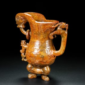 An Archaic Gaogu yu Dragon Pattern Tripod Goblet