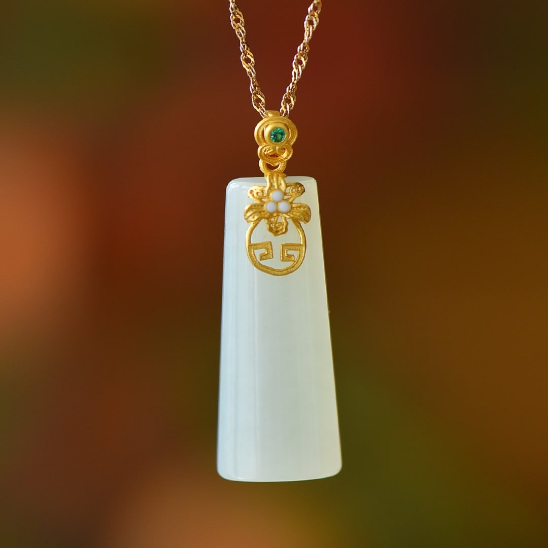 An Exquisite Sterling Silver-Gold Plated Inlaid White Jade Pendant: An Exquisite Sterling Silver-Gold Plated Inlaid White Jade Pendant,Size:0.4inx1.2in 纯银镀金镶白玉吊坠