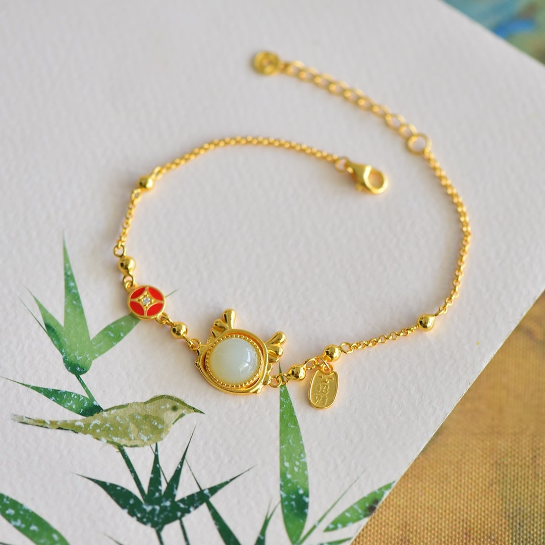 An Exquisite Sterling Silver-Gold Plated Inlaid White Jade Enamel Bracelet: An Exquisite Sterling Silver-Gold Plated Inlaid White Jade Enamel Bracelet 纯银镀金镶白玉珐琅手镯