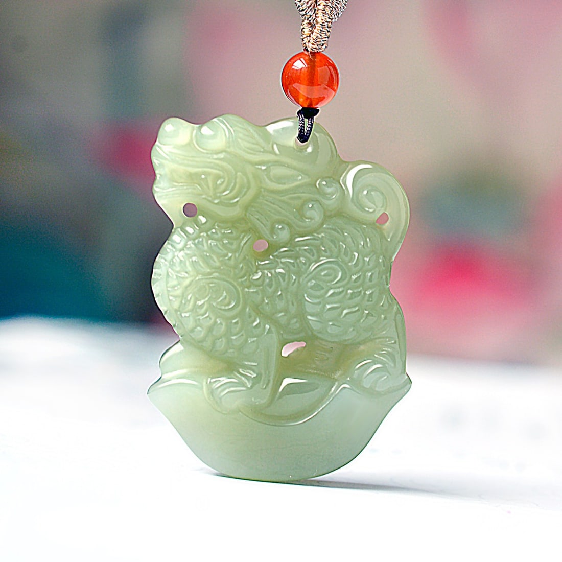 An Exquisite Greenish Jade Kylin Pendant (1 of 4)