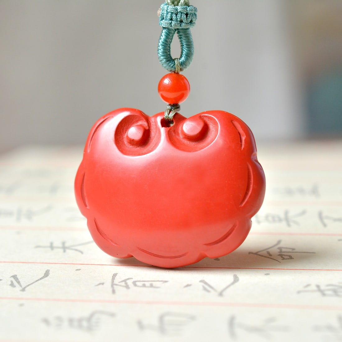 An Exquisite Cinnabar Lock-Shaped Pendant: An Exquisite Cinnabar Lock-Shaped Pendant,Size:0.9inx1.2in (寓意)吉祥招财喜庆、驱邪避凶 