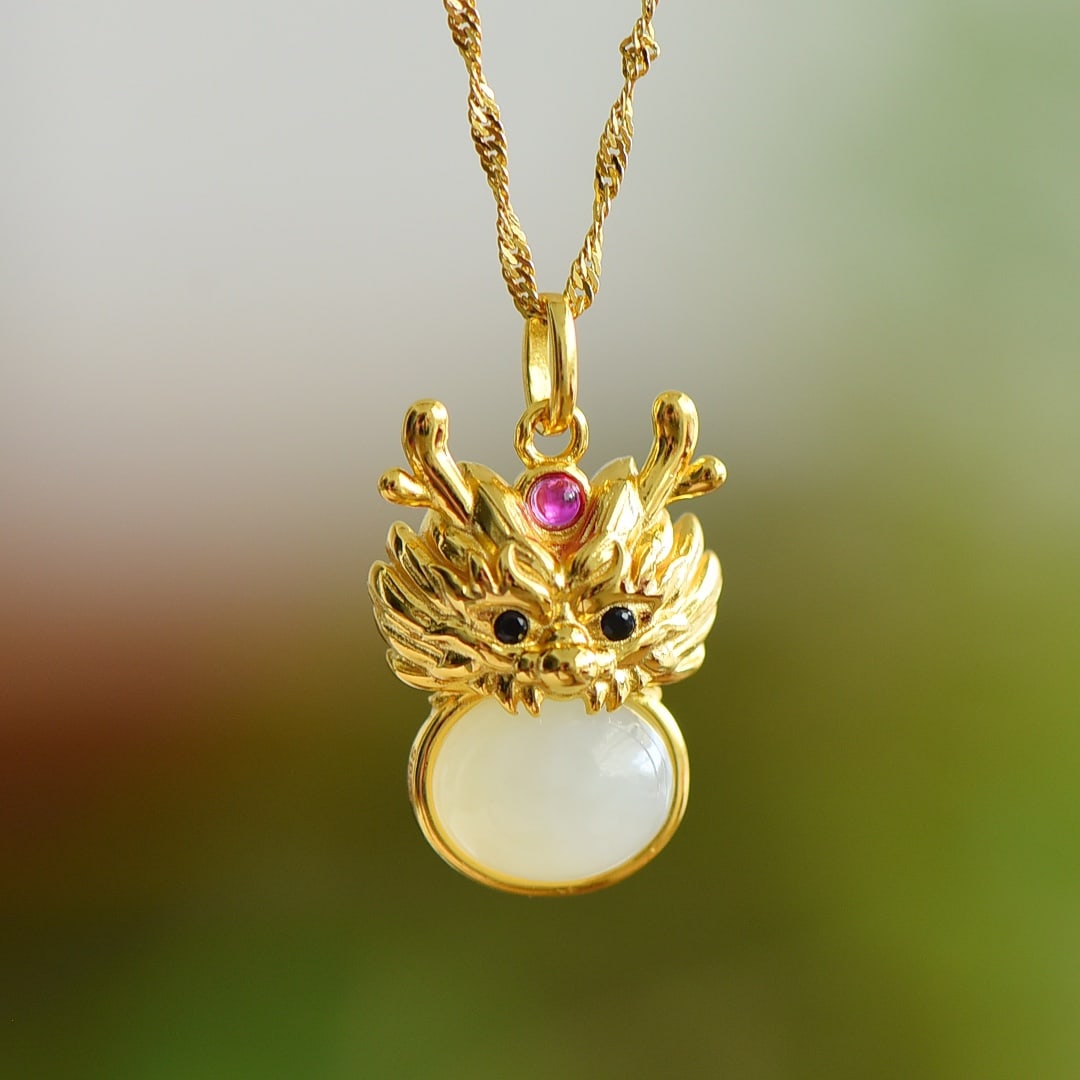 An Exquisite Sterling Silver-Gold Plated Inlaid White Jade Pendant: An Exquisite Sterling Silver-Gold Plated Inlaid White Jade Pendant,Size:0.3inx0.4in 纯银镀金镶白玉吊坠