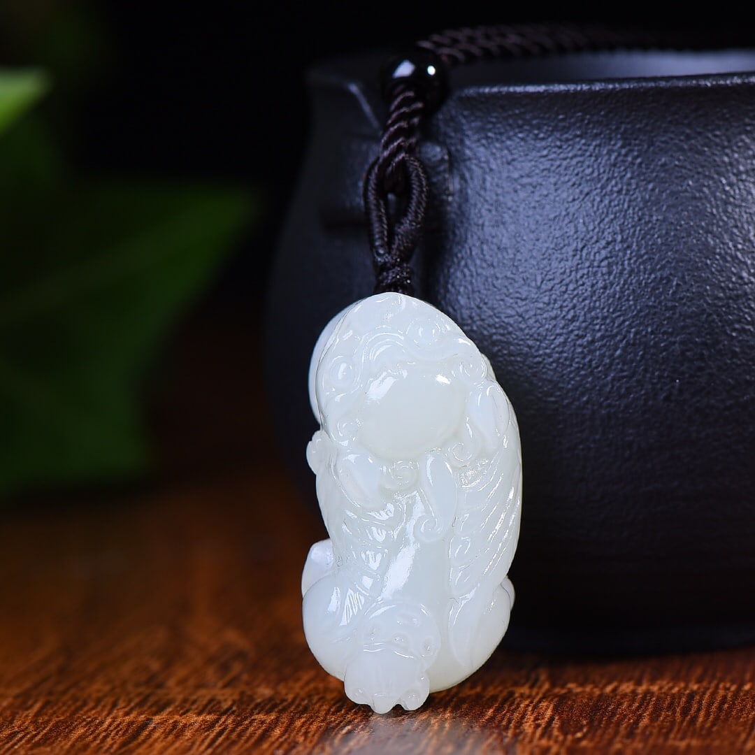 An Exquisite White Jade Wealth-Attracting Creature Pendant: An Exquisite White Jade Wealth-Attracting Creature Pendant,Size:0.6inx0.9in 白玉貔貅挂件