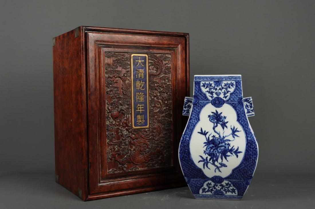 A Rare Blue and White Flower and Fruit Pattern Double-Ears Vase: A Rare Blue and White Flower and Fruit Pattern Double-Ears Vase,Qing Dynasty,China,Qianlong Six-character Mark,Size:12.6inx7.9in 青花花果纹双耳瓶,ߑ