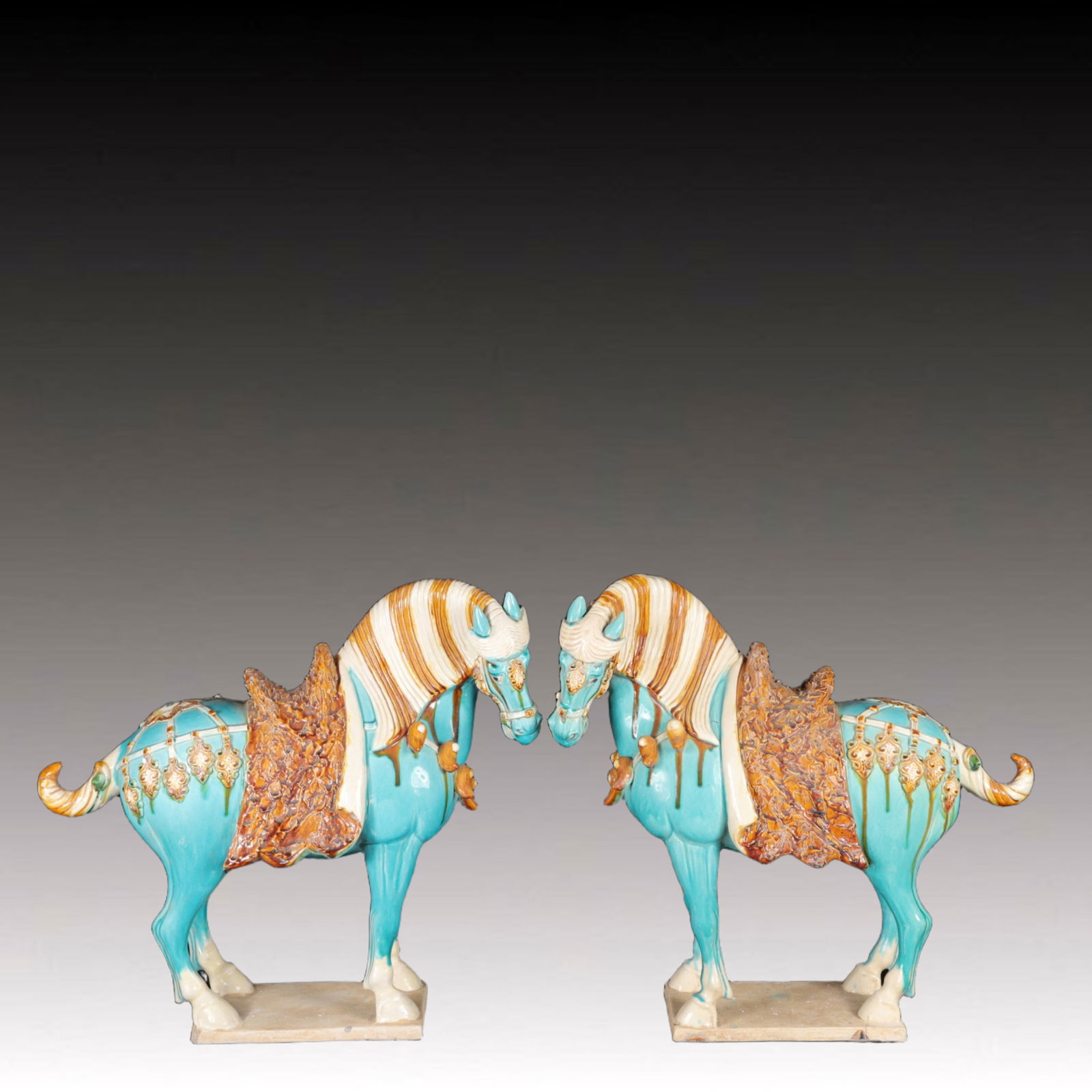A Pair of Rare Tang Tri-Color Glazed Pottery Horse Ornaments: A Pair of Rare Tang Tri-Color Glazed Pottery Horse Ornaments,Tang Dynasty,China,Size:19.3inx7.5inx17.7in,Weight:12550g 