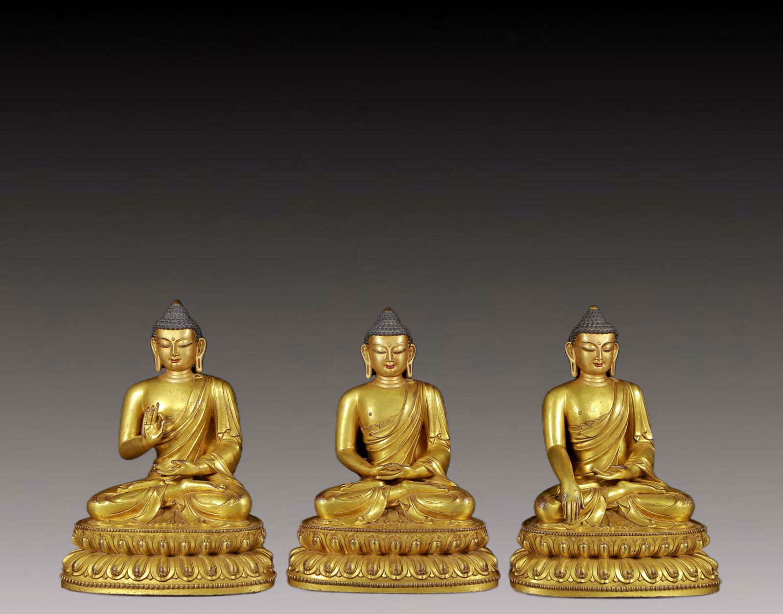 Brilliant Gilt-Bronze Figures Of Buddha Shakyamuni: Brilliant Gilt-Bronze Figures Of Buddha Shakyamuni. Each is superbly and sensitively sculpted in the form of a seated Buddha Shakyamuni, with well-defined arched eyebrows juxtaposed with the