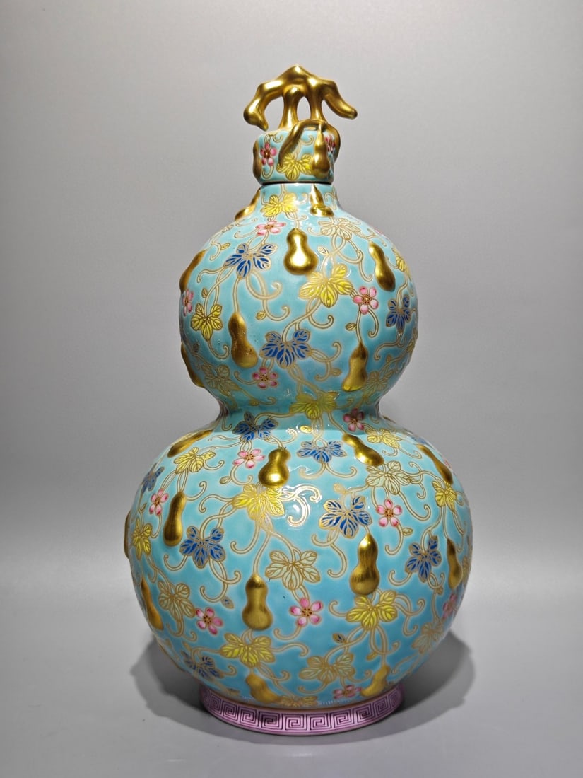 An Exquisite Turquoise Glazed Enamel Painted Gold Gourd Pattern Gourd-Shaped Vase: An Exquisite Turquoise Glazed Enamel Painted Gold Gourd Pattern Gourd-Shaped Vase,Qing Dynasty,China,Qianlong Four-character Mark,Size:11.2inx6.3in 松石绿釉珐琅