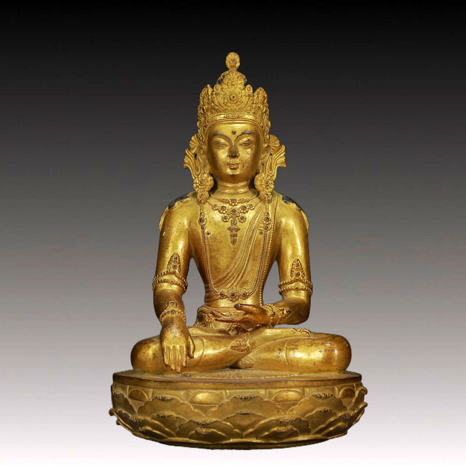 A Solemn Gilt Bronze Buddha: A Solemn Gilt Bronze Buddha,Ming Dynasty, China,Size: 6.3inx10.2in,Weight:3910g 铜鎏金佛像，明代